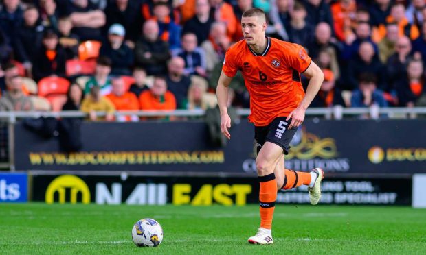 Sam McClelland strides out from the back for Dundee United