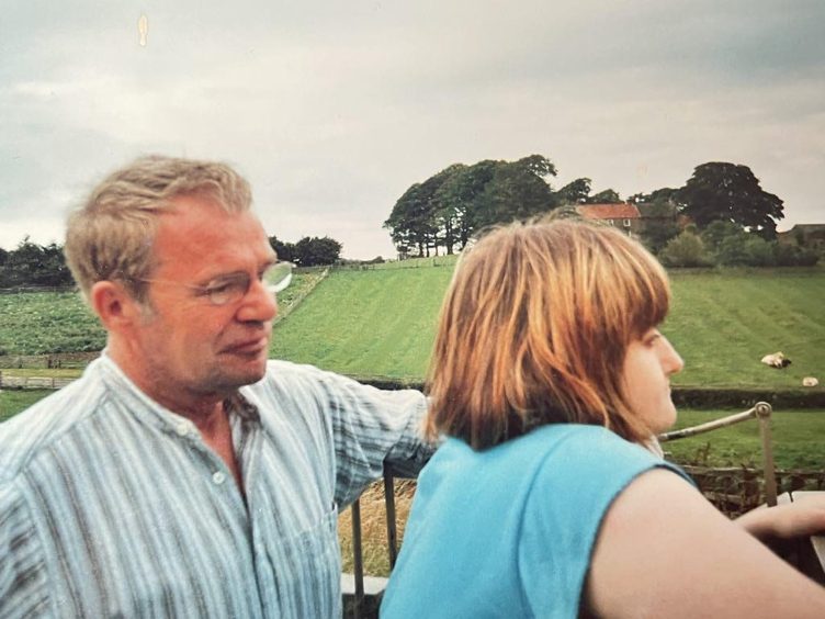 Becky with her late dad William, as they look out over some fields
