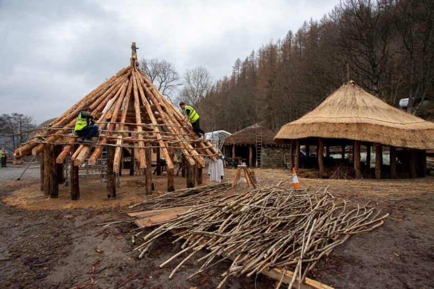 People working on buildings at Scottish Crannog centre