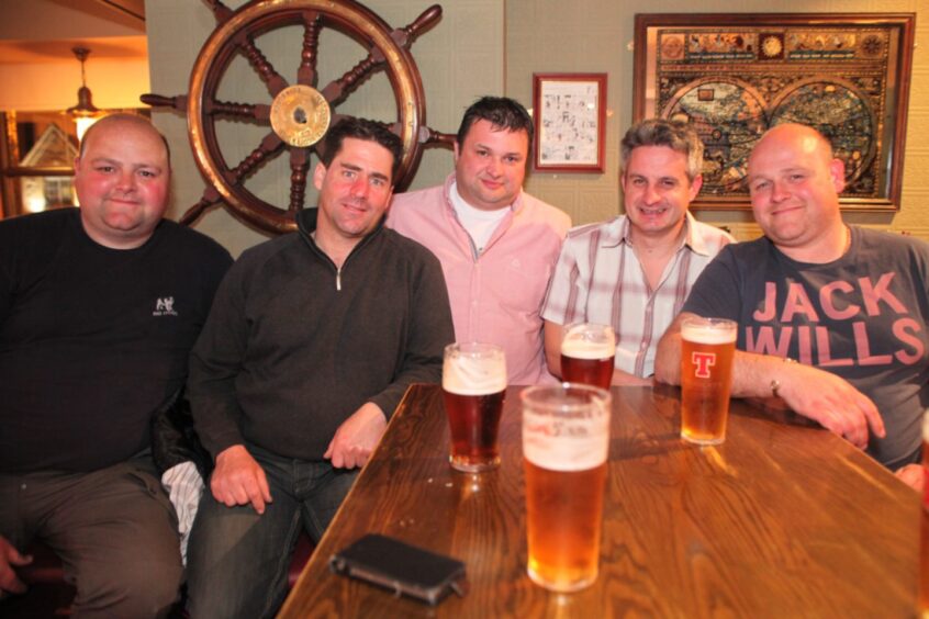 Five men enjoying a pint in the Dundee pub in 2012.