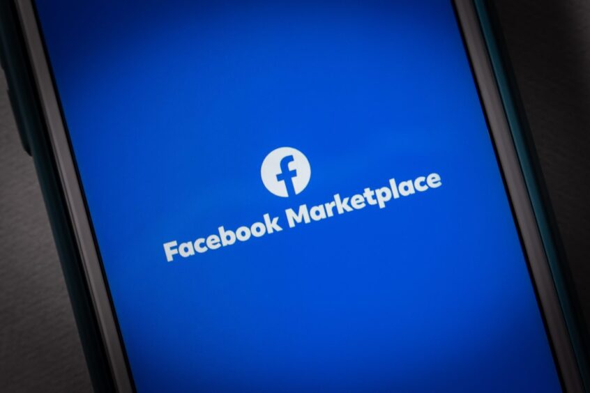 Facebook Marketplace logo on phone