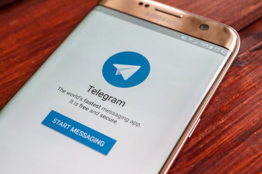 Telegram logo on mobile phone