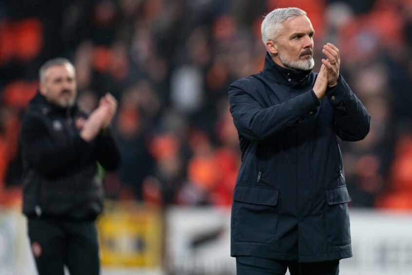 Dundee United manager Jim Goodwin applauds fans at Tannadice 