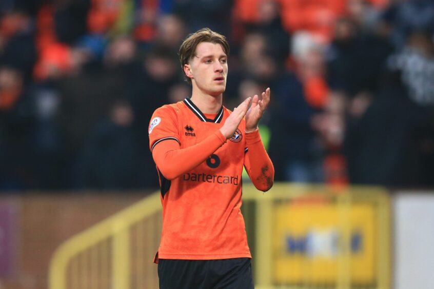 Alex Greive applauds the Dundee United fans