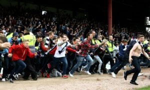 The Dundee fans invade the pitch at the final whistle. Image: DC Thomson.