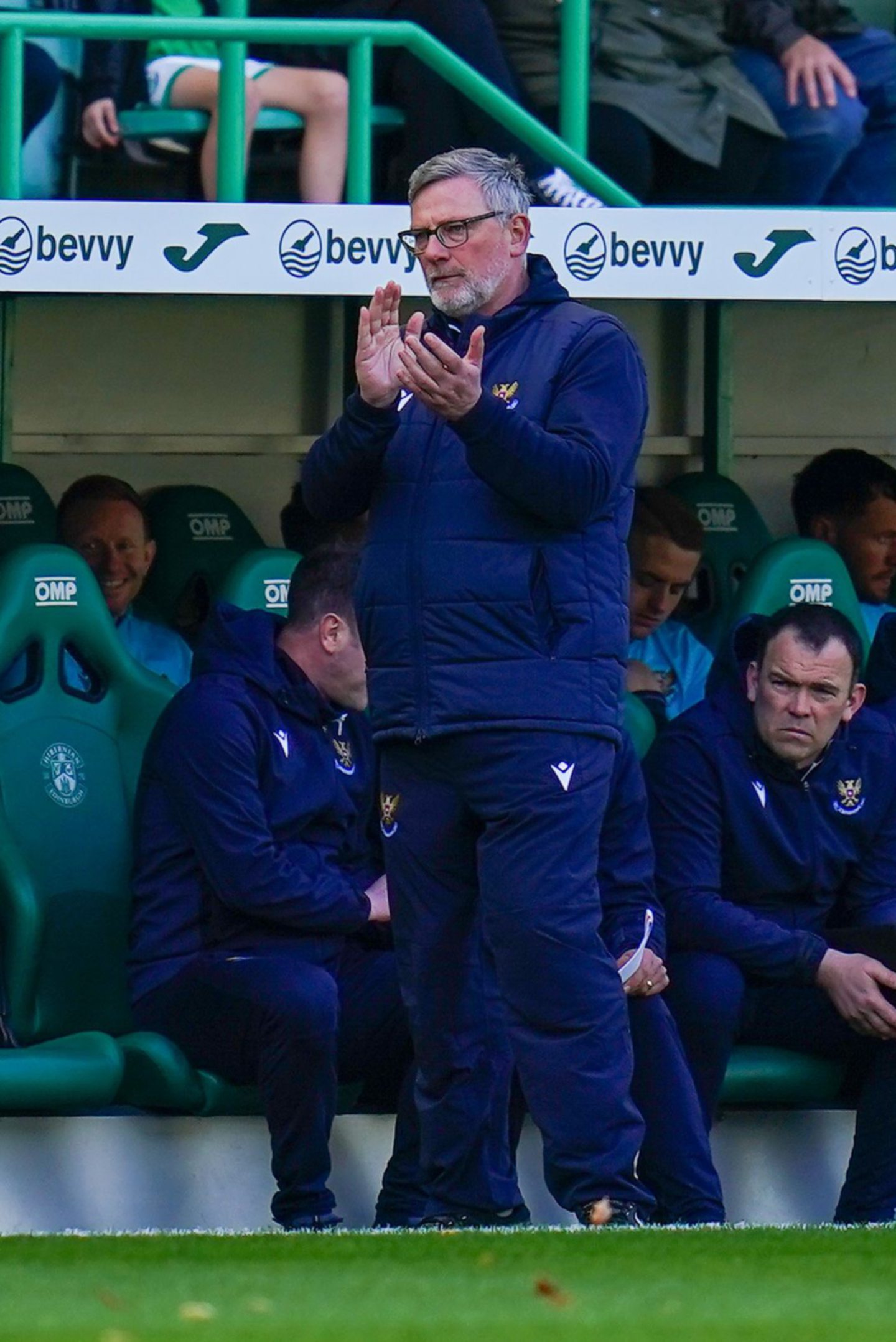 Craig Levein clapping in front of the dug out at Easter Road during Hibs v St Johnstone