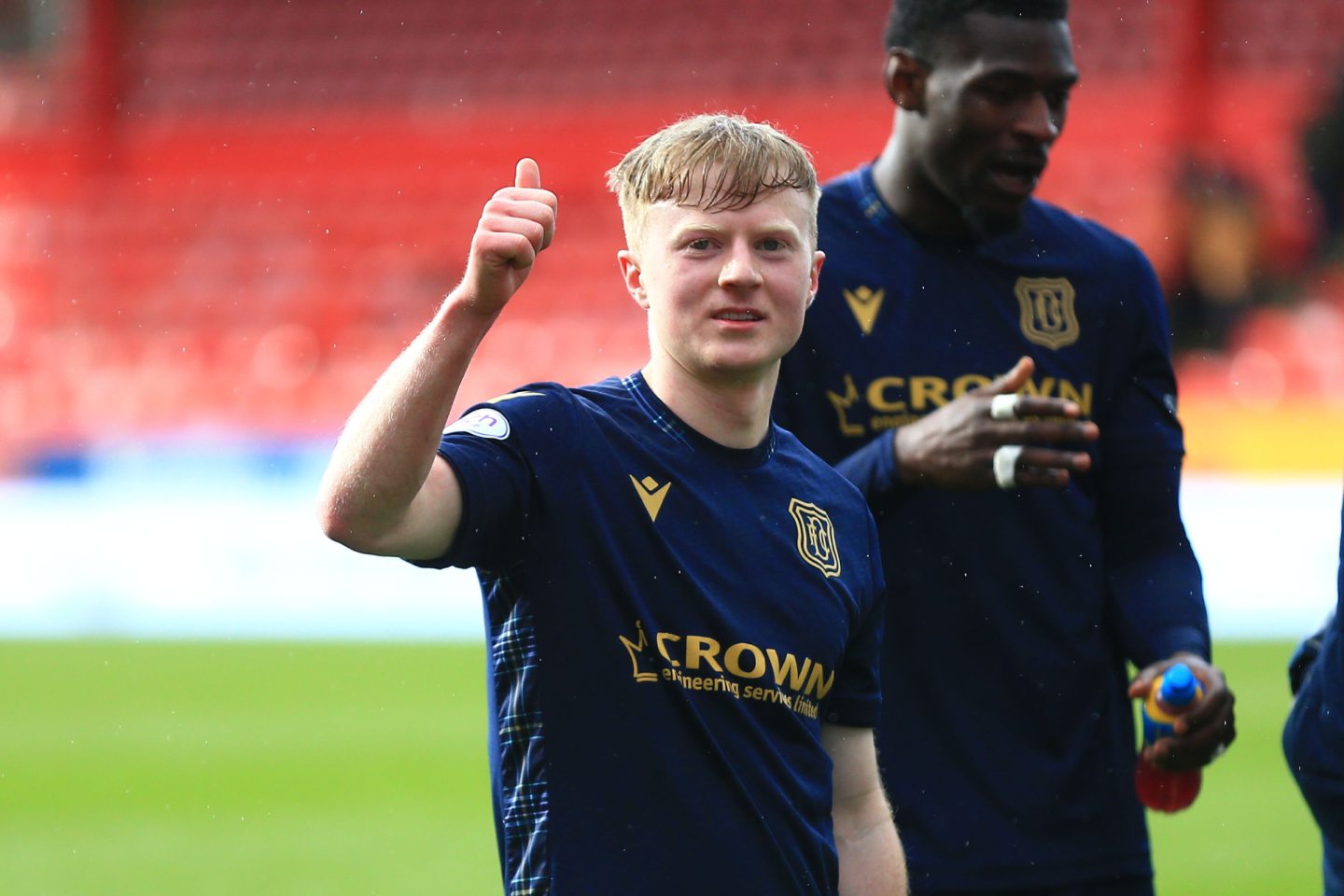 Lyall Cameron salutes the travelling Dundee fans at full-time. Image: Shutterstock