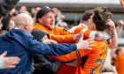 Dundee United trio Miller Thomson, No.29, Mochrie and substitute Rory MacLeod are among those to lap up the celebrations with fans