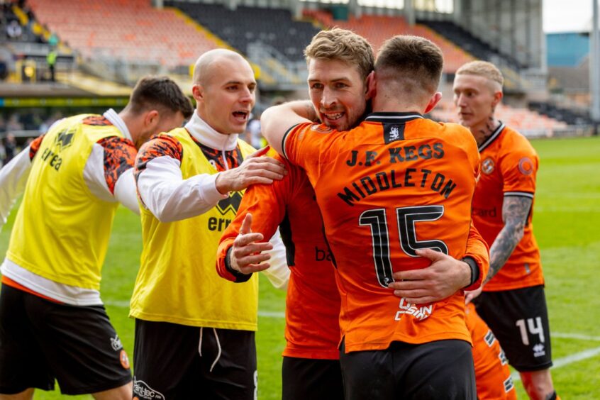 Dundee United's David Wotherspoon is embraced by Glenn Middleton