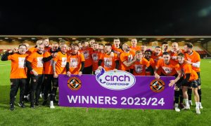 The Dundee United players celebrate their title being made official