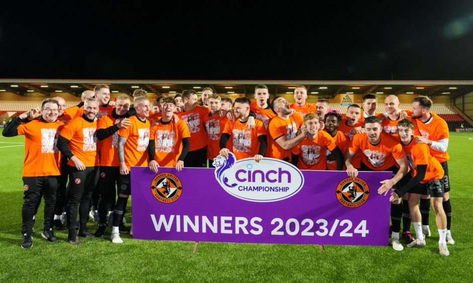 The Dundee United players celebrate their title being made official