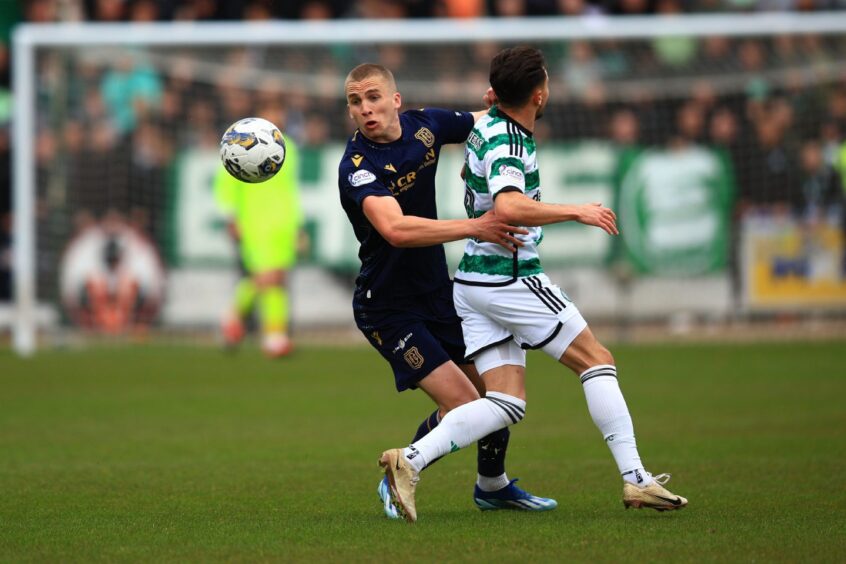 Dodgson challenges Celtic winger Nicolas Kuhn. Image: Shutterstock/David Young