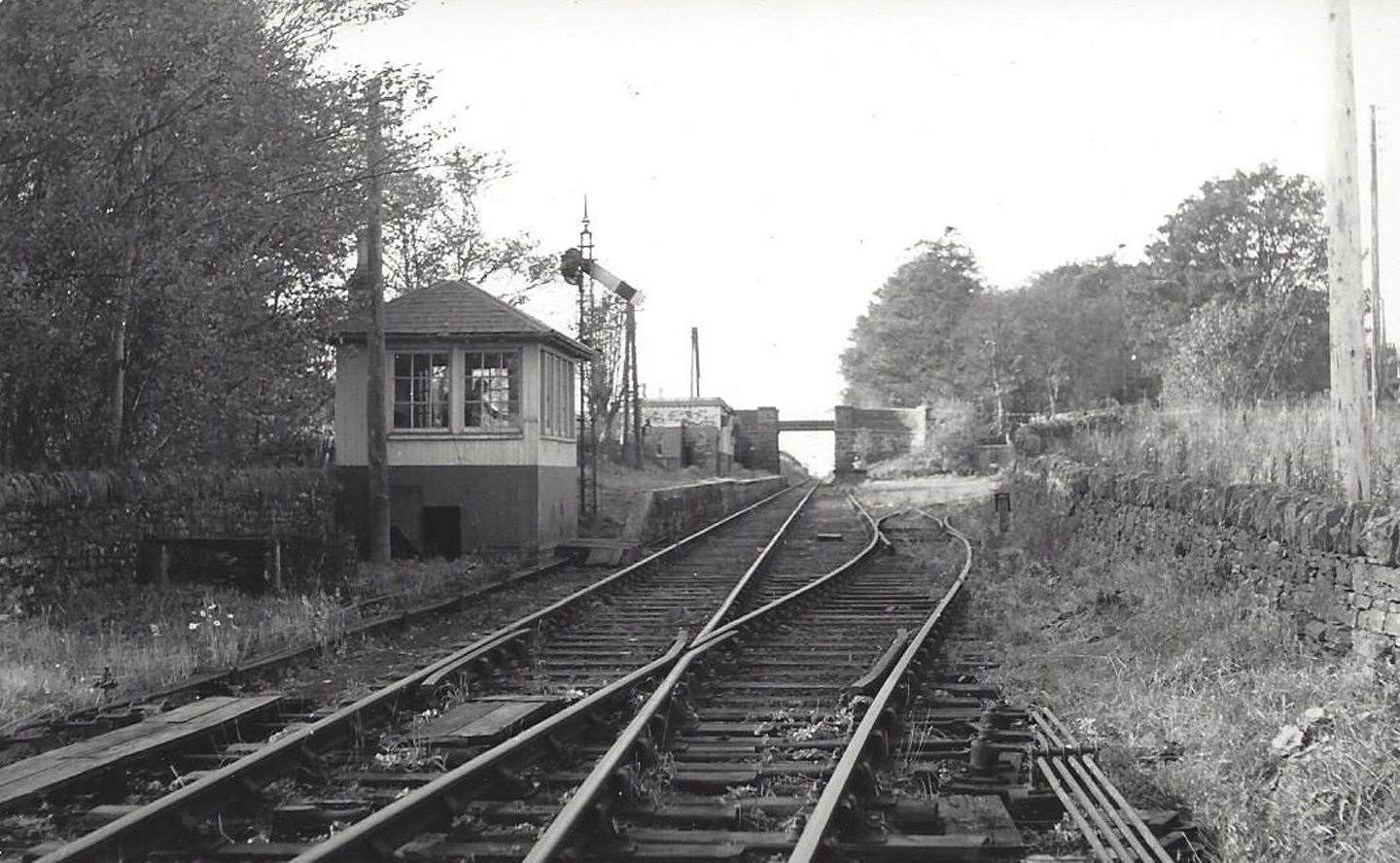 A signal house sits on the left as the tracks stretch into the distance looking towards Dundee from Monikie Station in 1967