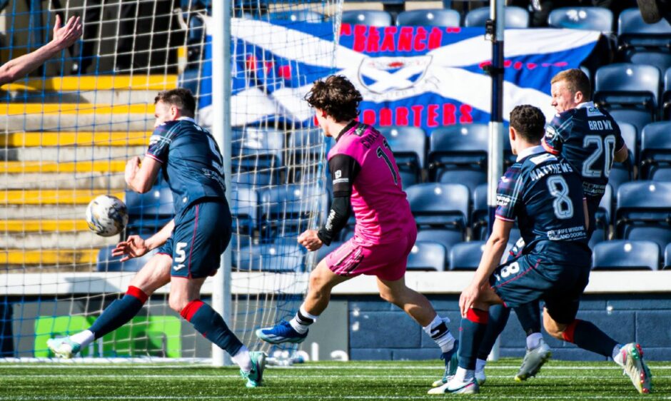 Logan Chalmers squeezes his shot past Raith Rovers defender Keith Watson to score Ayr United's equaliser.