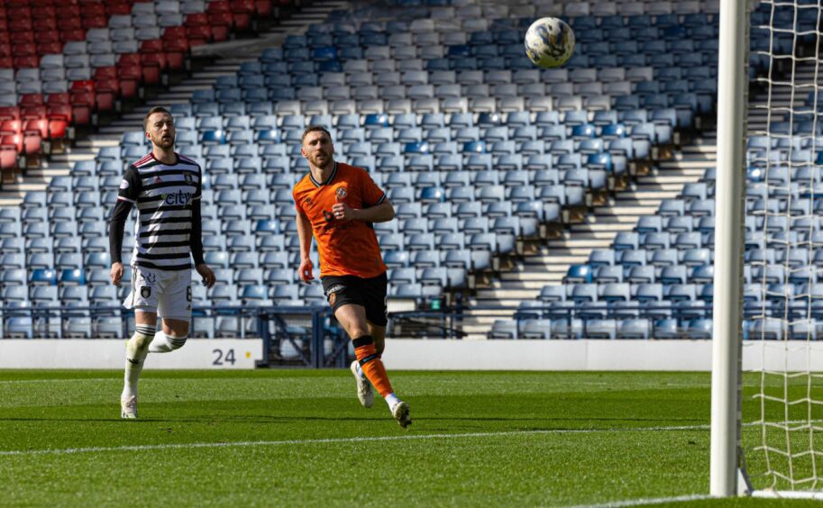 Dundee United striker Louis Moult watches his smart lob find the net for 2-0