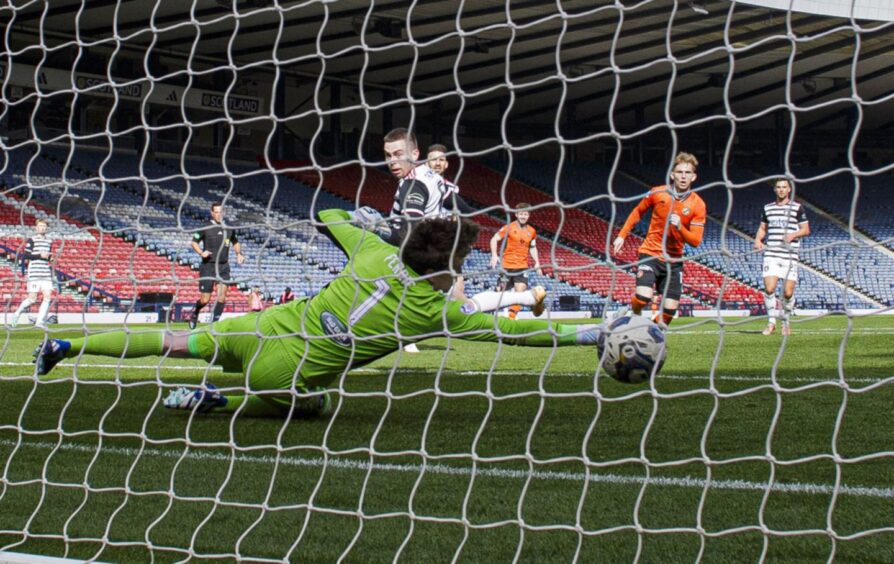 Dundee United forward Kai Fotheringham slots home his first goal of the game