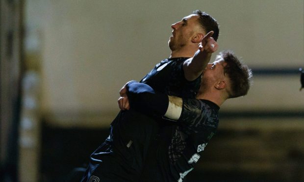 Dundee United Goalscorer Louis Moult is congratulated by man of the match Ross Docherty