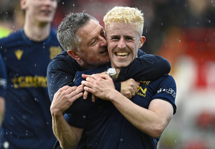 Luke McCowan (right) celebrates Dundee sealing a top six Premiership place with manager Tony Docherty. Image: Rob Casey/SNS