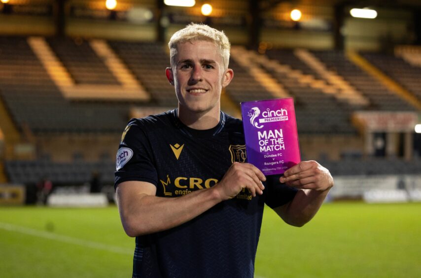 Luke McCowan with his Man of the Match award against Rangers. Image: SNS