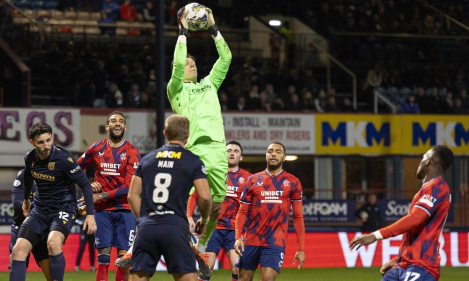 Dundee's Jon McCracken claims the ball during Wednesday's draw with Rangers. Image: SNS.