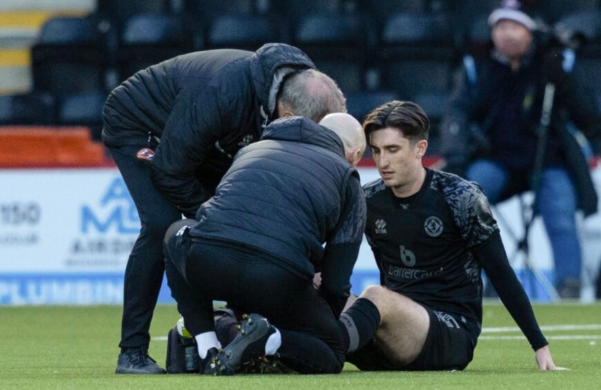 Dundee United's Chris Mochrie was forced off with an injury