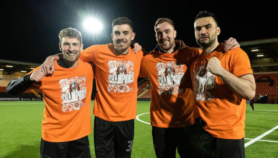 From left: Dundee United's David Wotherspoon, Declan Gallagher, Kevin Holt and Tony Watt celebrate the Tangerines' title win on the pitch.