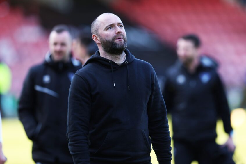 Dunfermline Athletic FC manager James McPake looks up at the East End Park stand in thoughtful mood after avoiding the possibility of relegation.