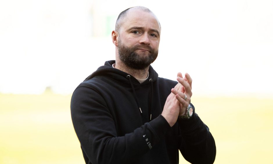 Dunfermline Athletic F.C. manager James McPake claps the supporters.