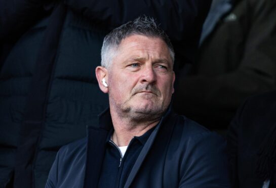 Tony Docherty in the stands as his Dundee take on Celtic. Image: SNS