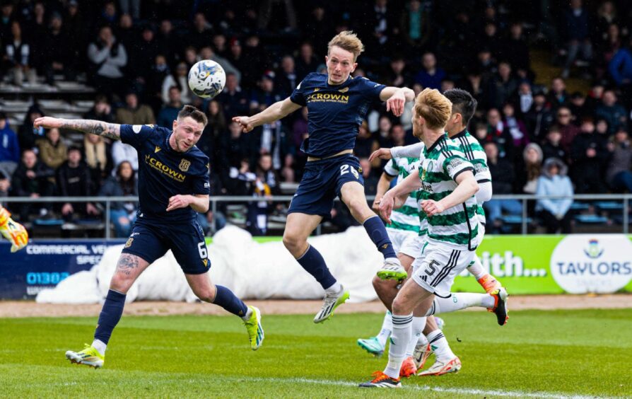 Michael Mellon heads wide in stoppage time as Dundee pushed for an equaliser against Celtic. Image: SNS