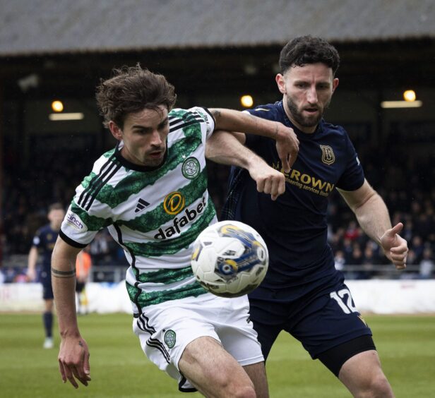 Ricki Lamie gets to grips with Celtic's Matt O'Riley. Image: SNS