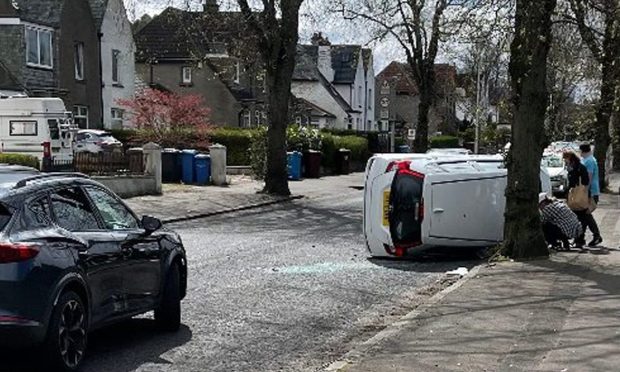 The car crashed on its side on Johnston Avenue, Dundee. Image: Grant Scott