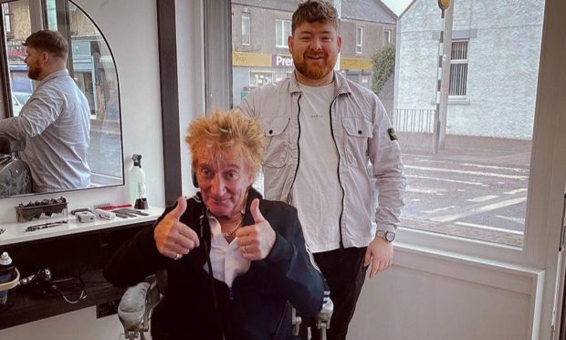The spoof photo of Methil barber, Cammy Barnes with Sir Rod Stewart.
