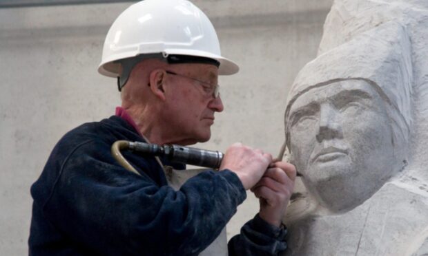 Bruce Walker at work on the Antarctic expedition memorial which stands in Glen Prosen. Image: DC Thomson