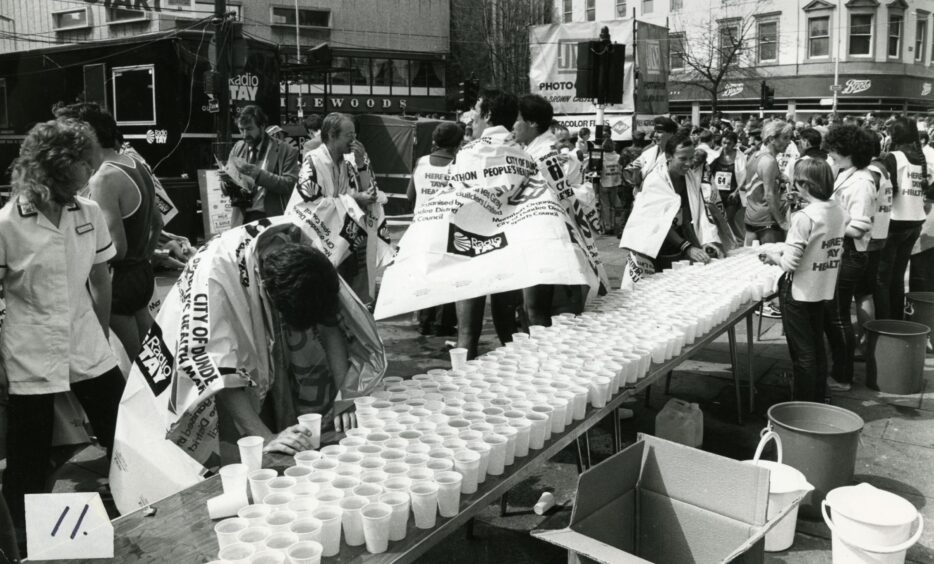 A table full of drinks is a welcome sight for the thirsty runners in City Square. 