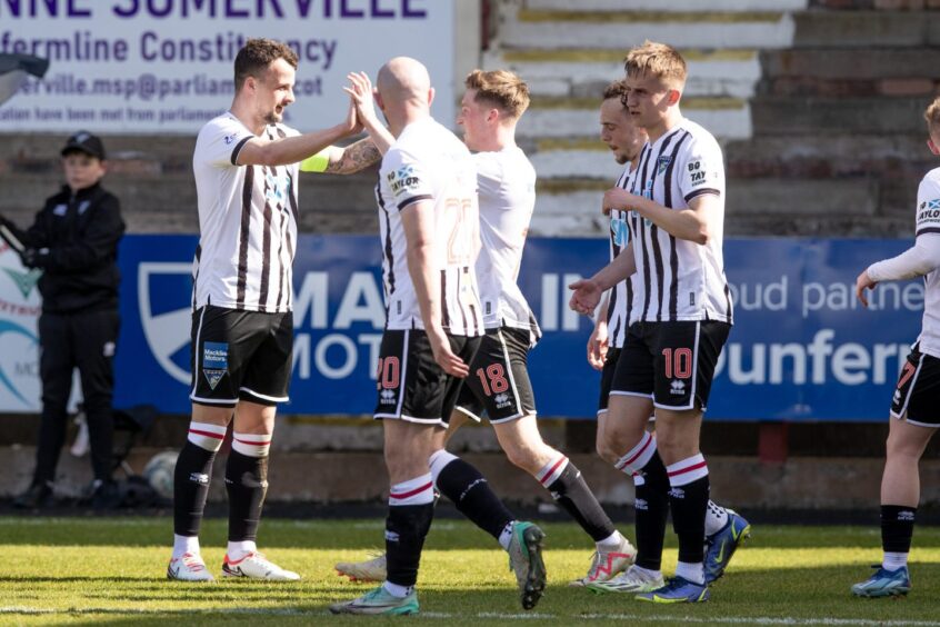 Captain Kyle Benedictus celebrates his goal with his Dunfermline Athletic FC team-mates.