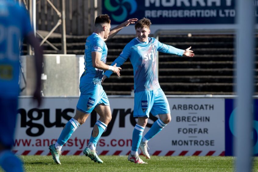 Arms outstretched, Paul Allan is congratulated by team-mate Josh Edwards after scoring for Dunfermline Athletic F.C.