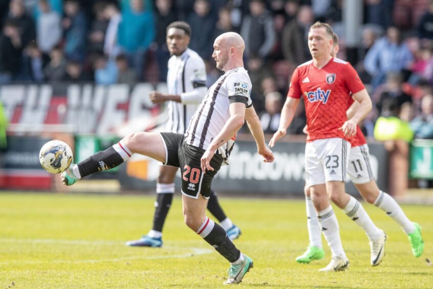 Chris Kane on the ball against Queen's Park. Image: Craig Brown/DAFC. 