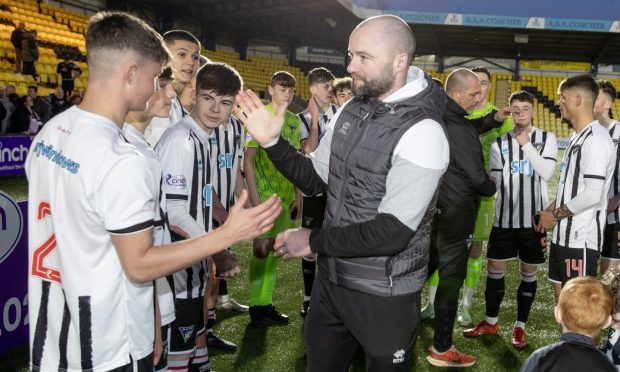 Dunfermline Athletic F.C. manager James McPake congratulates Pars players after their SPFL Reserve Cup success.