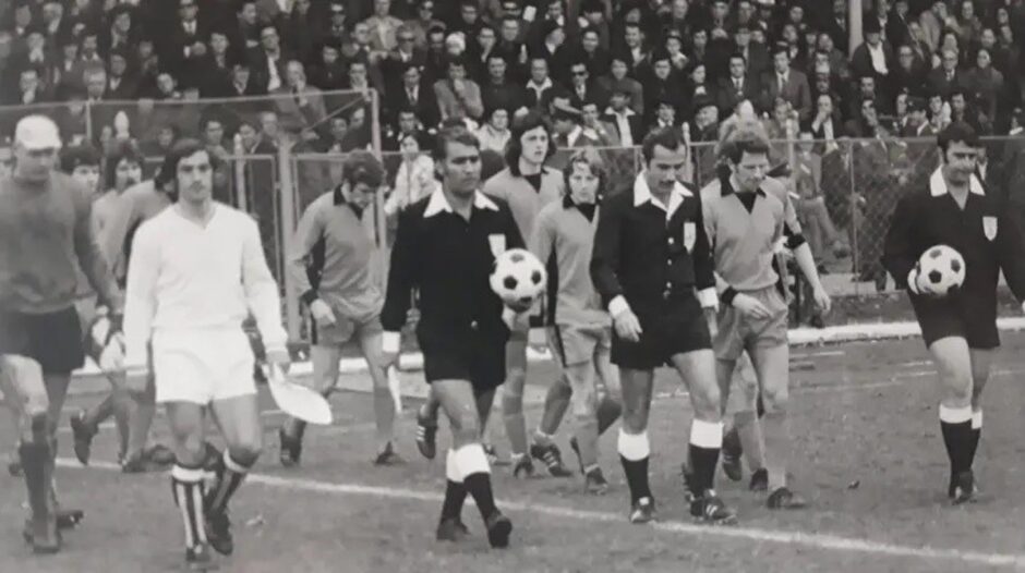 The match officials and the Dundee United and Petrosani players walk out on to the pitch before the second leg in Romania.