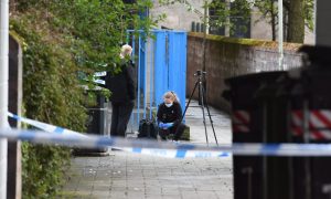 A forensic officer at Ropemakers Close in Perth City Centre. Image: Stuart Cowper