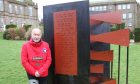 David McGregor next to the memorial dedicated to wife Heather at Dundee and Angus College's Arbroath campus