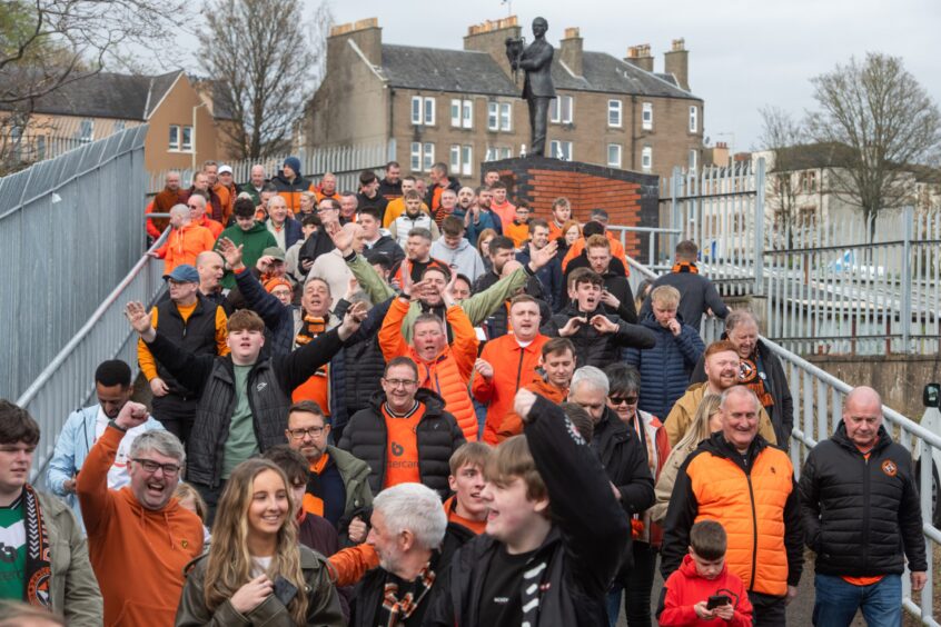 United fans get the party stated in the shadow of the statue of the late, great Jim McLean