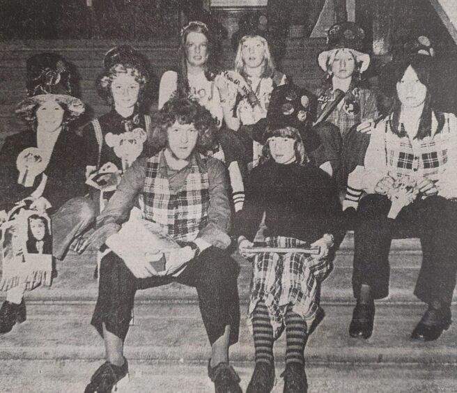 The eight finalists in the fancy dress competition where the winner got to meet Slade.
