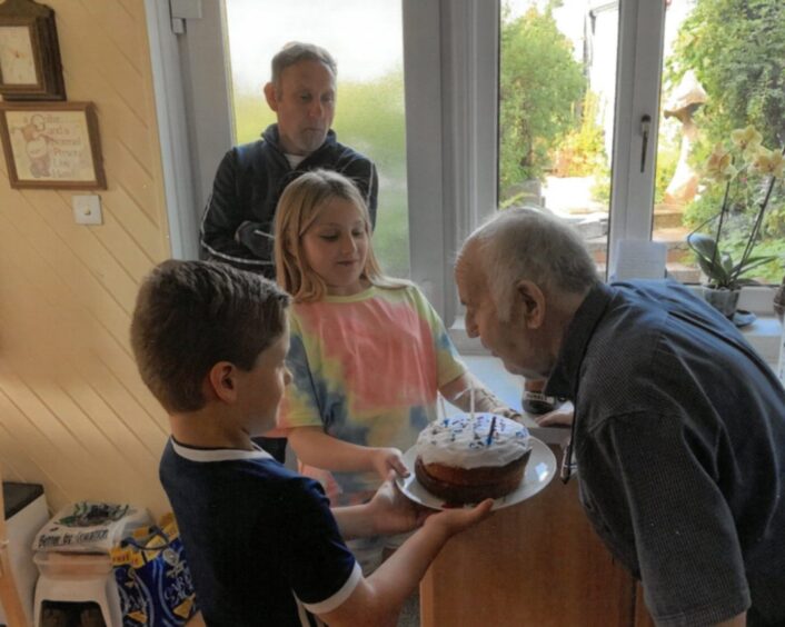 Forbes Stephen celebrates a birthday with two of his grand children and son Hamish.