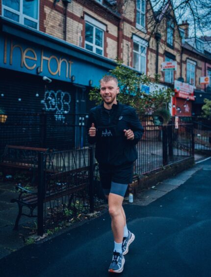 Fraser Morrison smiling as he runs