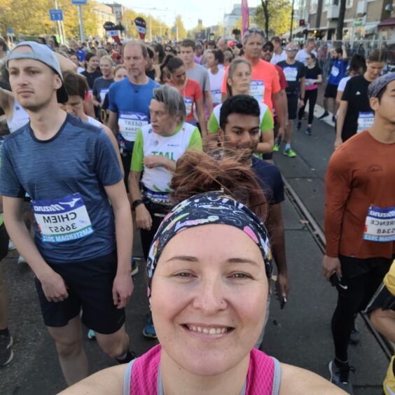 A selfie of Gemma at start line for Amsterdam half marathon