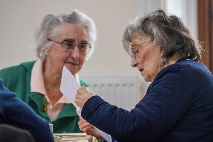 Some of the Horizon Lunch Club members enjoy the food and social interaction.