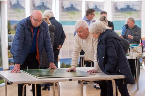 Locals pore over the Letham Grange plans at the consultation event. Image: Kim Cessford/DC Thomson