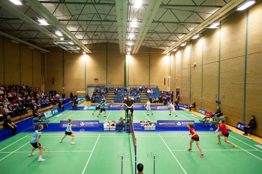Badminton games being played inside Bell's Sports Centre, Perth
